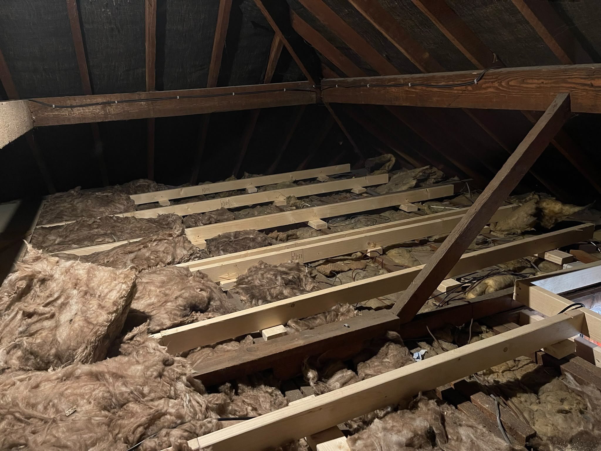 Loft joists and insulation prepared before boarding
