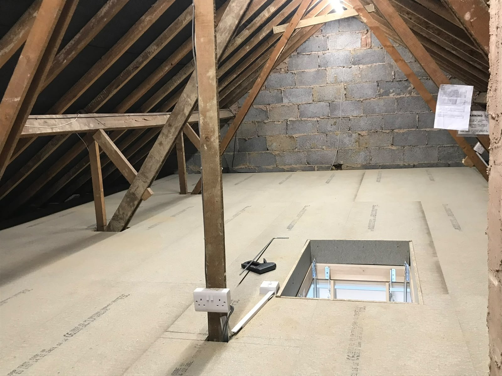 Loft lighting and sockets fitted beside boarded storage